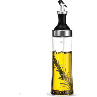 Un récipient en verre à haute teneur en borosilicate pour le ménage avec un tuyau incurvé et un régulateur de mesure de l'huile est stocké